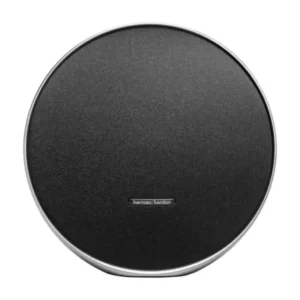 Round black Harman Kardon speaker with a silver rim, viewed from above (top-down)